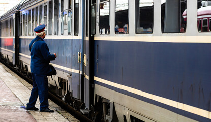 Train crew doing the last checking on the platform at the Bucharest North Railway Station (Gara de...