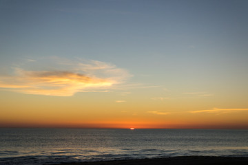 Naklejka na ściany i meble Beautiful sky in a sunset on the beach.