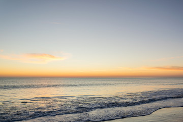 Fototapeta na wymiar Beautiful sky in a sunset on the beach.