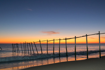 Naklejka premium Magnificent long exposure sunset on the beach and sea.