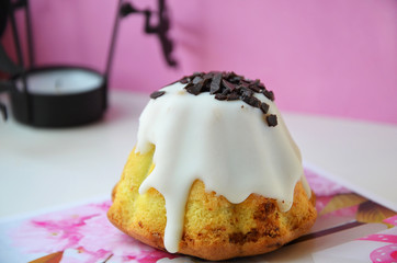 mini cupcake with icing on a pink background