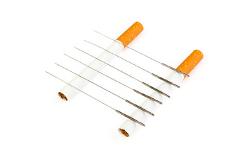 Acupuncture to stop smoking. Voodoo cigarettes. Acupuncture needles are on the cigarette. Traditional ancient Chinese medicine.