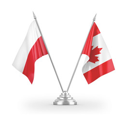 Canada and Poland table flags isolated on white 3D rendering