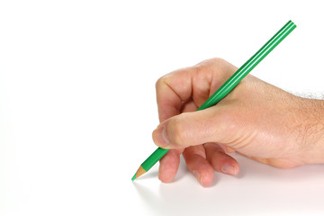hand writing on a white sheet of paper with a green pencil