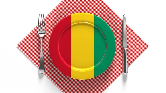 National cuisine and dishes of Guinea. Delicious recipes from Africa. Flag on a plate with food from Guinea.