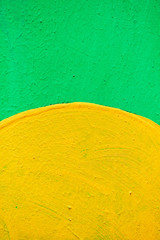 Abstract texture of plaster of green and yellow.