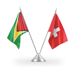 Switzerland and Guyana table flags isolated on white 3D rendering