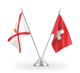 Switzerland and Jersey table flags isolated on white 3D rendering