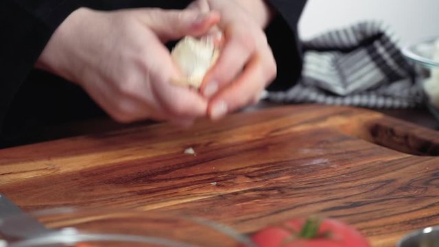 Step by step. Crushing garlic for beet soup, borscht.