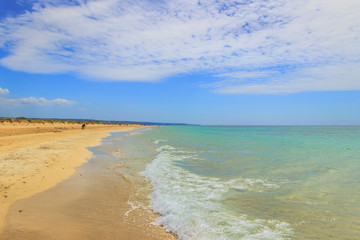 Fototapeta na wymiar The most beautiful sandy beaches of Apulia: Salve beach in Salento, Italy. From Torre Pali to Pescoluse the shore is made of a so fine white sand and vashed by a so clear sea. 
