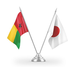 Japan and Guinea-Bissau table flags isolated on white 3D rendering