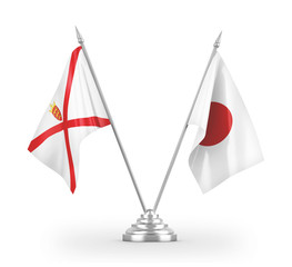 Japan and Jersey table flags isolated on white 3D rendering