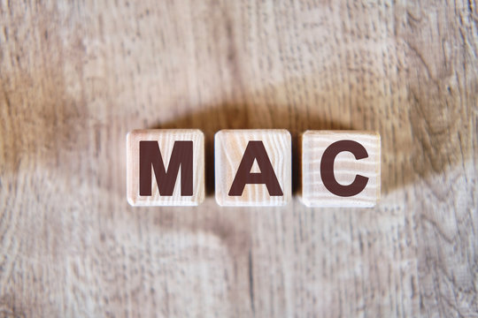 MAC - Media Access Control acronym concept on cubes - Powered by Adobe