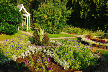 A flower garden is planted in a recreated colonial estate