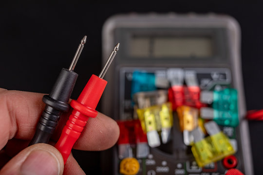 Measurement Of Resistance Of Car Fuses With An Electric Meter. Checking The Conductivity Of Electrical Protections In The Installation.