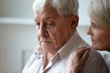 Caring old wife support caress sad senior husband