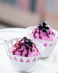 cupcakes with fillet icing and blueberries and currants