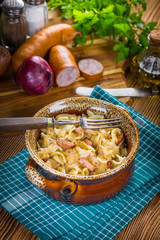 Pasta with sauerkraut and sausage.