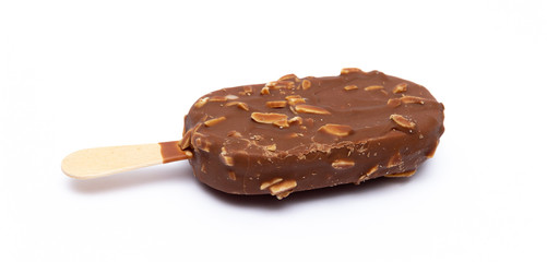 Chocolate ice cream with nuts on a stick. Isolated on a white background. Tasty dessert.