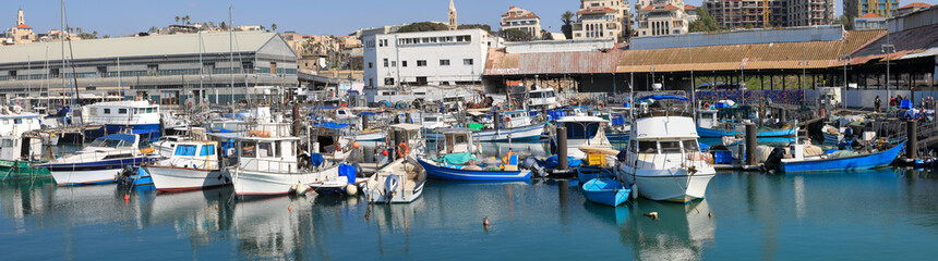 Fototapeta na wymiar Yachts and fishing boats anchor at Port. Panoramic View.