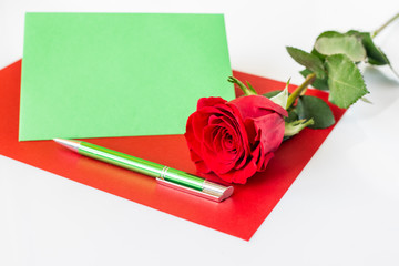 Red rose and envelope, Valentine`s Day isolated on white background