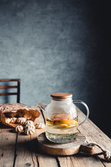 Hot tea with slices of fresh grapefruit on wooden tablet. Healthy drink, Eco, vegan