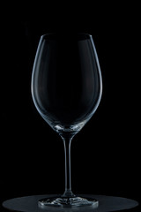 transparent glass wine glass on black background