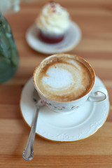 Close-up cup of coffee with foam drawing