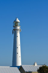 Tall White Lighthouse Tower Over Rooftops, Cape Town, South Africa