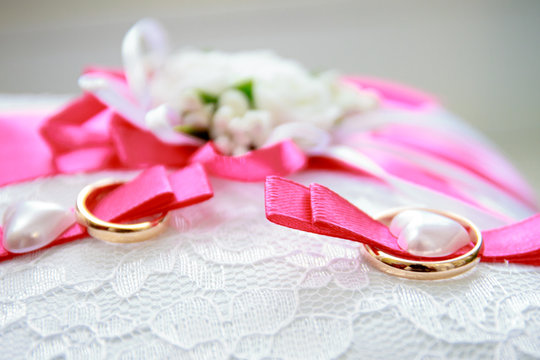 Wedding rings on the pillow