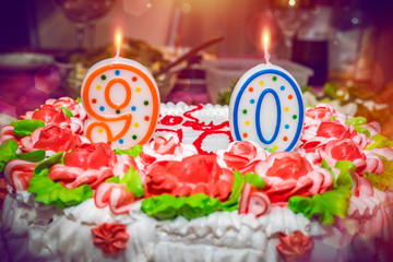 ninety years anniversary. Cake with decoration in the form of flowers, patterns and numbers nine...
