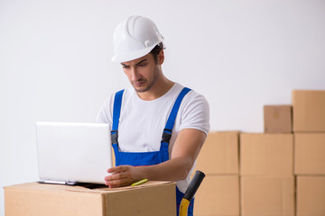 Young male professional mover doing home relocation