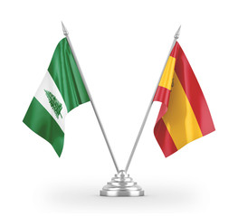 Spain and Norfolk Island table flags isolated on white 3D rendering