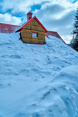Strong real winter in the south of Poland - lots of snow - the residential building is covered with...