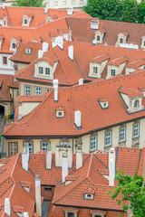 Fototapeta na wymiar Top view to red roofs of Prague city Czech republic.