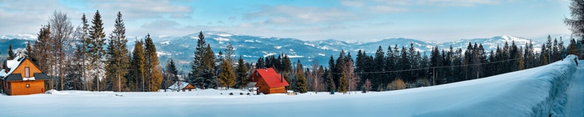 Beautiful winter mountain landscape in the south of Poland - the sun, a lot of snow, blue sky and old forest