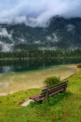 Fototapeta premium Bench by mountain lake Hintersee in Berchtesgaden national park, Deutschland