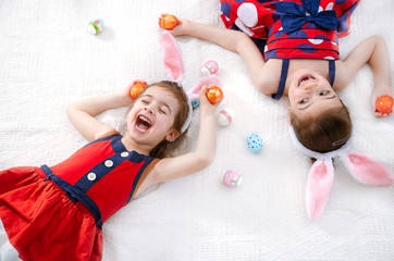 Happy easter Two funny cute girls with Easter eggs and Bunny ears.