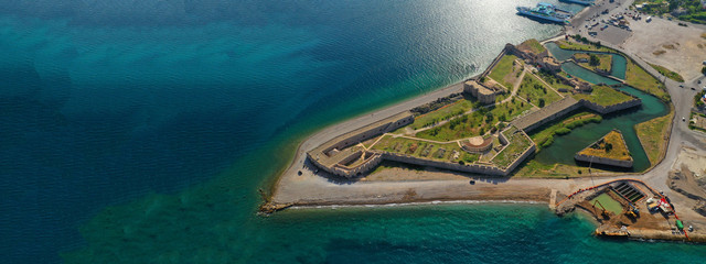 Aerial drone ultra wide photo of famous castle of Rio next to famous cable bridge of Harilaos...