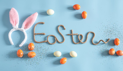 Easter creative inscription on a blue background.