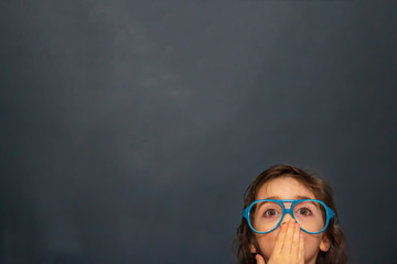 Little girl with blue plastic glasses