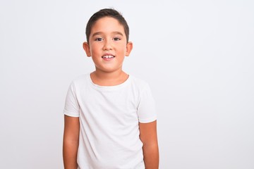 Beautiful kid boy wearing casual t-shirt standing over isolated white background with a happy and...