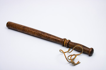 Wooden Night Stick with leather strap on white background
