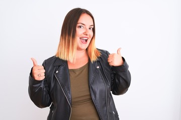 Young beautiful woman wearing t-shirt and jacket standing over isolated white background success sign doing positive gesture with hand, thumbs up smiling and happy. Cheerful expression and winner