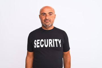 Middle age safeguard man wearing security uniform standing over isolated white background Relaxed...
