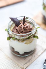 Granola with yoghurt on bright background