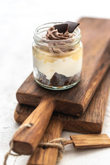 Granola with yoghurt on bright background