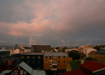 Cityscape over rekjavik with a rainbow