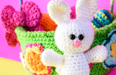 Colorful crocheted bunny with Easter eggs