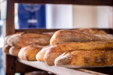 Sideways view of stack of french baguettes